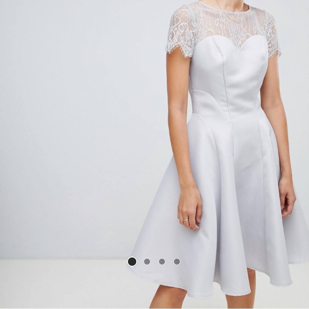 Silver dress with lace detail and buttoned back.